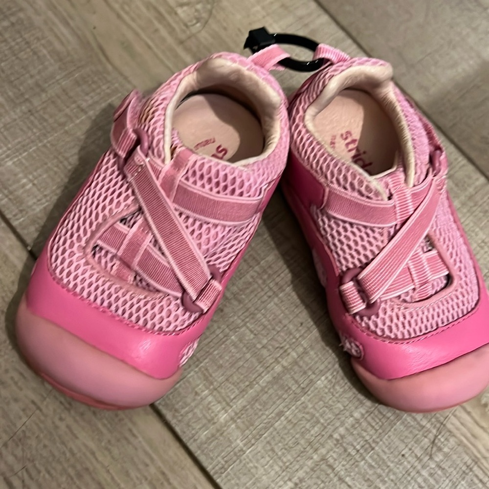Little girls stride, right tennis shoes with Velcro closure